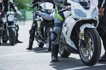 Obraz na płótnie Canvas Motorcycle luxury items close-up: headlights, shock absorber, wheel, wing, toning.