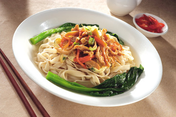 Pickled vegetables and shredded chicken with handmade noodles