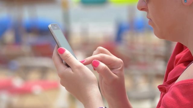 Two high quality videos of woman using mobile phone in 4K