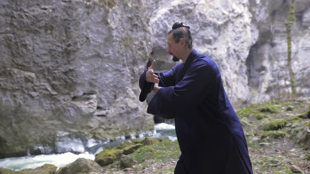 Kung Fu Master Perform Martial Arts Techniques in Cave 4K