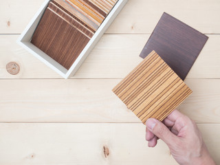 Samples of veneer wood on woodenbackground. interior design select material for idea.