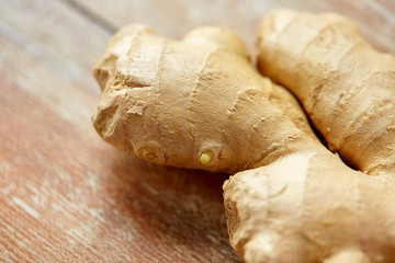 close up of ginger root on wooden table