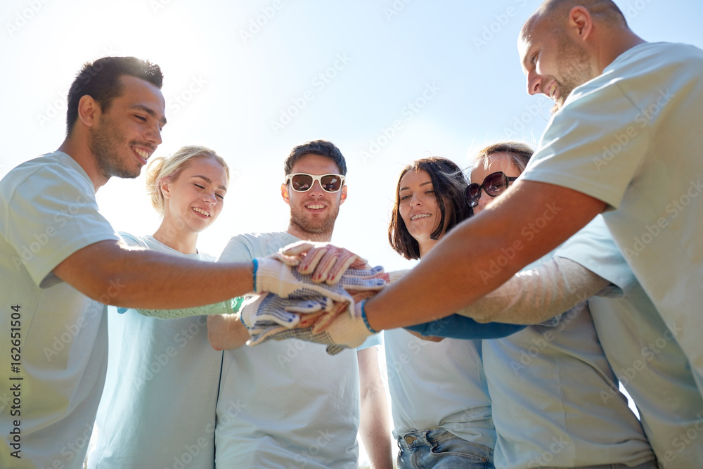 Canvas Prints group of volunteers putting hands on top outdoors