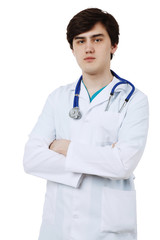 Fototapeta premium Young doctor in white coat over white background, isolated.