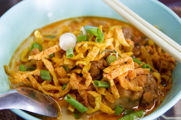 Traditional Thai curry chicken noodle close up.