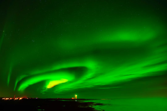 View of the northern light at Grotta Lighthouse in Reykjavik, Iceland.