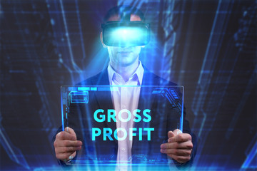 Business, Technology, Internet and network concept. Young businessman working in virtual reality glasses sees the inscription: Gross profit