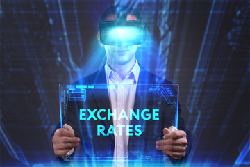 Business, Technology, Internet and network concept. Young businessman working in virtual reality glasses sees the inscription: Exchange rates