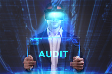 Business, Technology, Internet and network concept. Young businessman working in virtual reality glasses sees the inscription: Audit