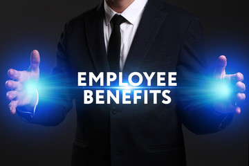 Business, Technology, Internet and network concept. Young businessman working on a virtual screen of the future and sees the inscription: Employee benefits
