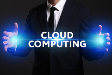Business, Technology, Internet and network concept. Young businessman working on a virtual screen of the future and sees the inscription: Cloud computing