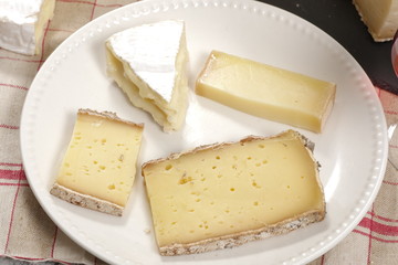 Different french cheeses on plate