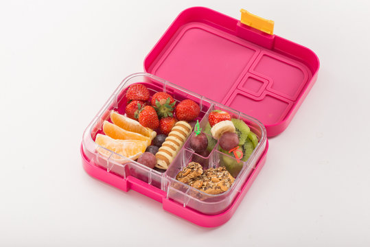 Fruits And Nuts In Lunchbox On White Background