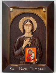 Carved icon from wood handmade. Holy timothy