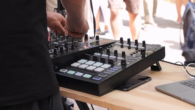 DJ hand mix dance music with mixer outdoor on May in Vilnius. Street music day. HD