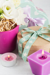 Arrangement of eustoma flowers in pot, pastel gift box