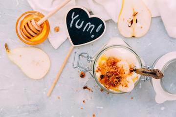 Homemade yogurt with pear and honey. Top view