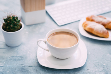 Morning Coffee mug with croissant  and keyboard