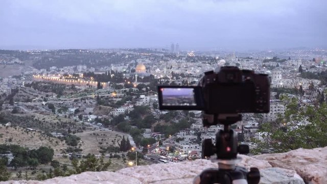 Camera shoots photo timelapse of the Jerusalem Old City view landscape. Mount Scopus is a famous Holy Land place and it has a fantastic view to the Old Jerusalem.