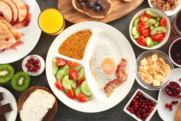 Delicious served breakfast on table