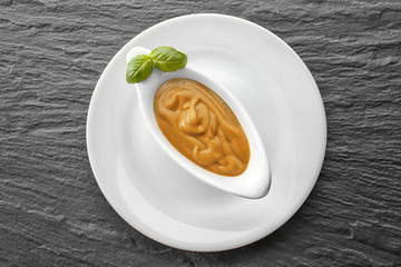 Sauce boat with turkey gravy on dark table