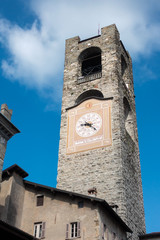 Fototapeta na wymiar BERGAMO, LOMBARDY/ITALY - JUNE 26 : Civic Tower (Campanone - Big Bell) and Palazzo Del Podestaore in Bergamo on June 26, 2017