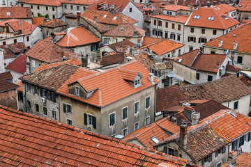 Fototapeta na wymiar Kotor city old town. Houses with red roof tops seen from above.