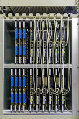 Cabinet with network server equipment, connected with wires. Technology background