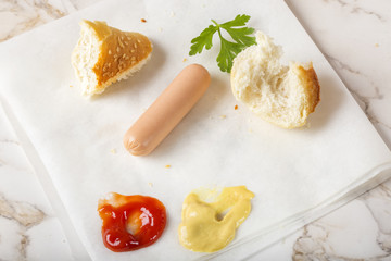 Eating Sausages (Frankfurter) with bread, mustard and ketchup