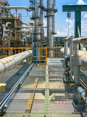 The equipment of oil refining in process area ,Close up of industrial pipelines of an oil refinery...