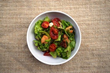Fresh vegetable salad, healthy food, tomatoes and salad leaves. Healthy chicken salad with fresh vegetables