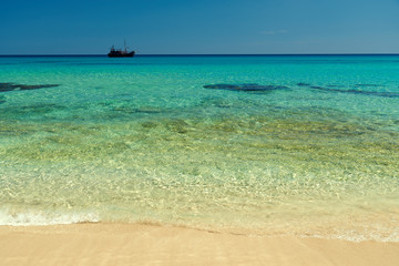 Fototapeta na wymiar Beach with transparent water.