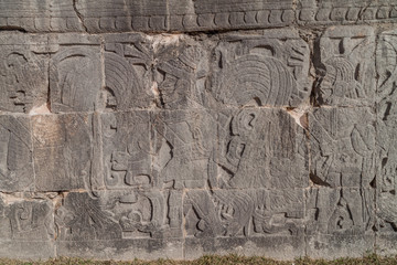 Reliefs of the players at the great ball game court at the archeological site Chichen Itza, Mexico.