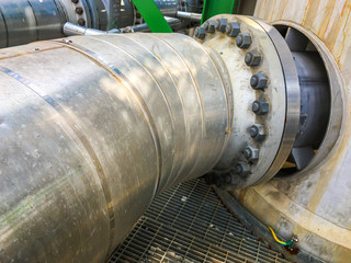 Close up of pipe flanges with bolts and nut