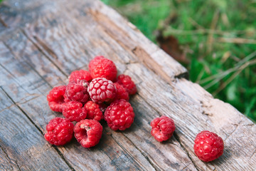 Raspberries on a wooden surface