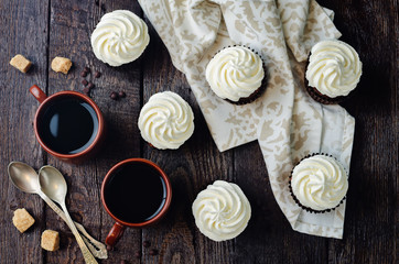 Fototapeta na wymiar Chocolate cupcakes with ricotta cream frosting