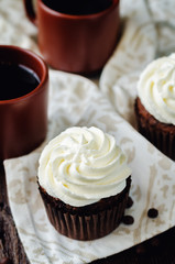 Chocolate cupcakes with ricotta cream frosting