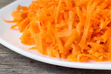 plate with fresh grated carrot