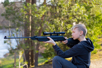 teenager with air gun