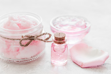 Obraz na płótnie Canvas homemade spa with rose cosmetic set, cream, salt and oil on white background