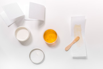 Set for depilation with wax on white background top view