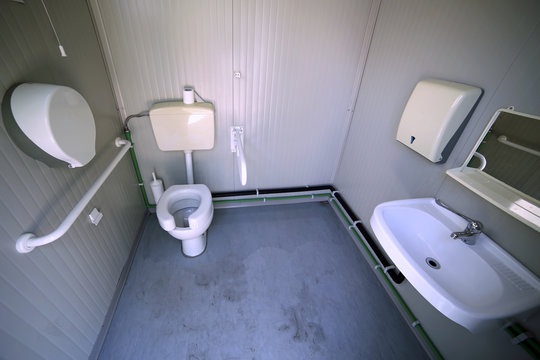 Inside the disabled bathroom with the special water closet
