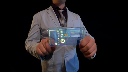 Man with a futuristic screen.  The concept of the future interface on a transparent display