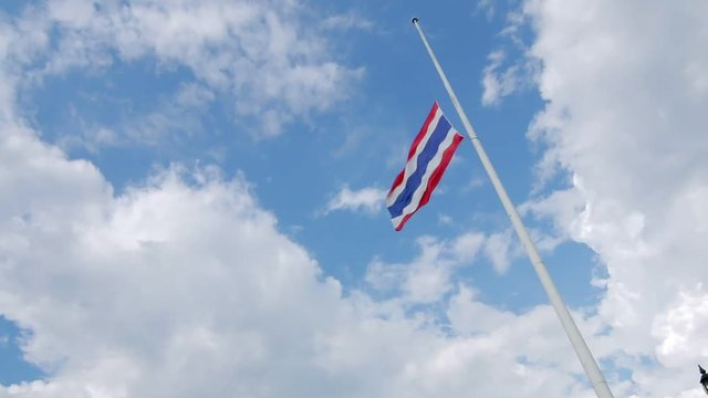Waving Thailand flag with cloud and blue sky background