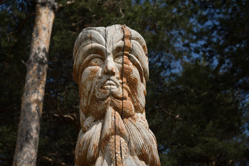 Fototapeta na wymiar Wooden statue of the idol.