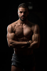 Fototapeta na wymiar Portrait Of A Physically Fit Muscular Model