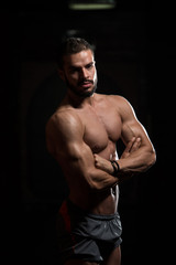 Fototapeta na wymiar Model In Gym Showing His Well Trained Body