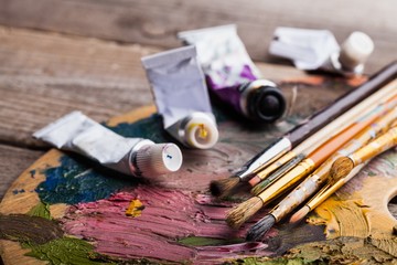 Oil paints and paint brushes.