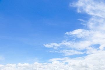 beautiful soft white clouds on blue sky with space for background and design
