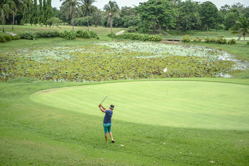 Fototapeta na wymiar A man is playing golf